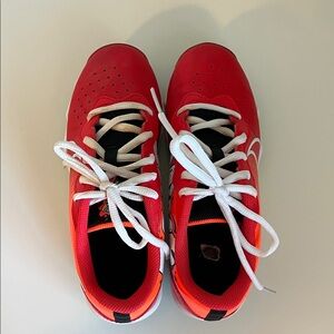 Nike (kids) red baseball/football cleats